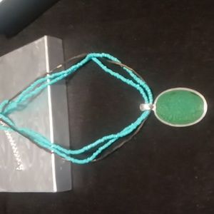 Teal green Seed bead necklace with faux jade green & silver pendant.